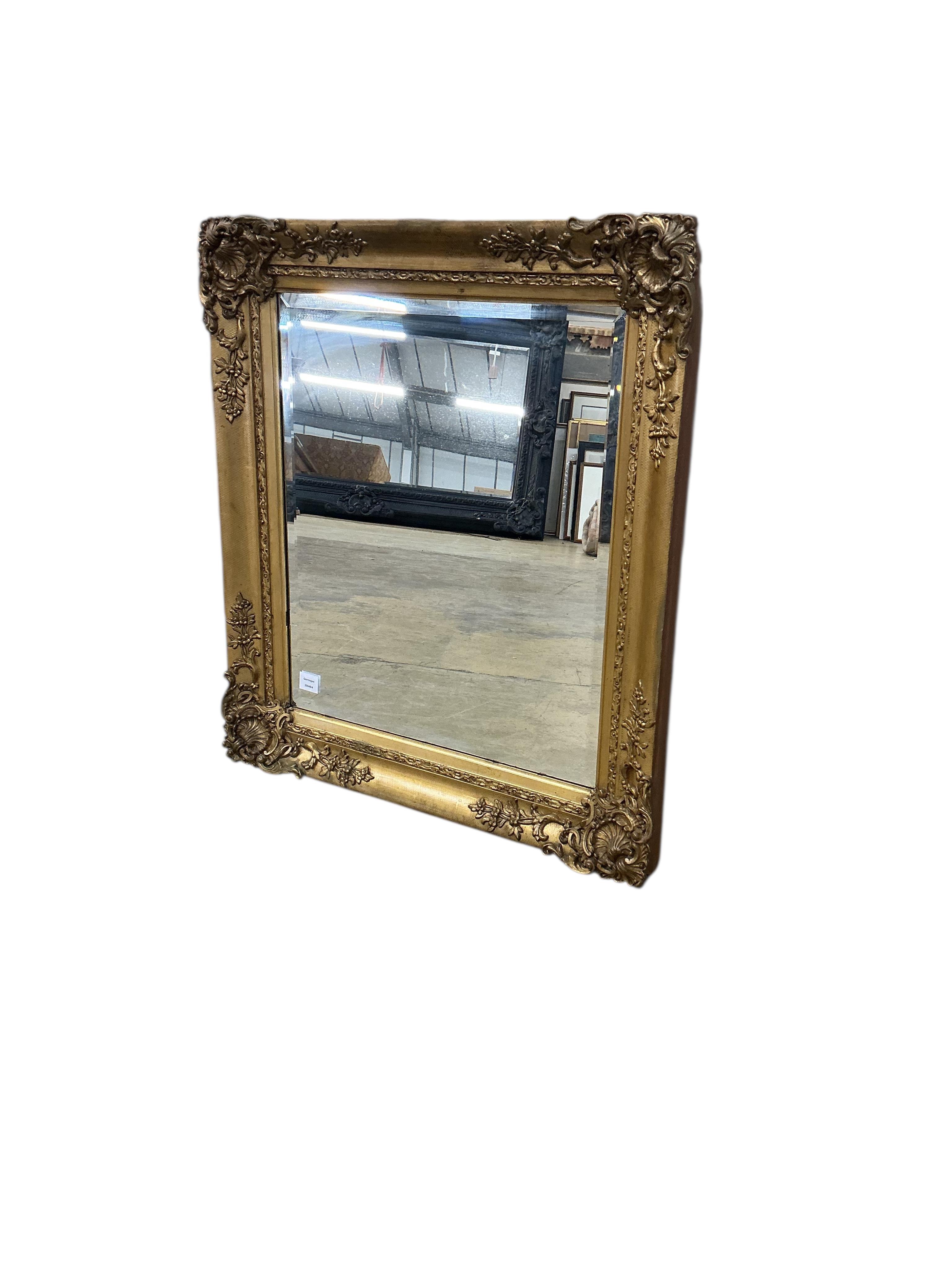 A Victorian rectangular giltwood and composition picture frame, now as a wall mirror, width 79cm, height 92cm